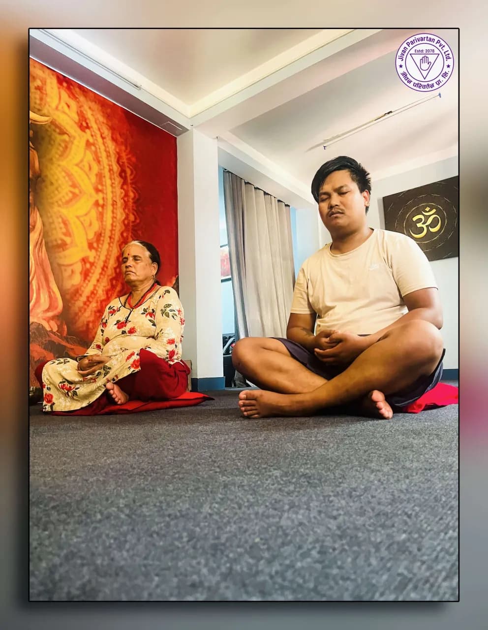 A student sitting cross-legged in meditation with eyes closed